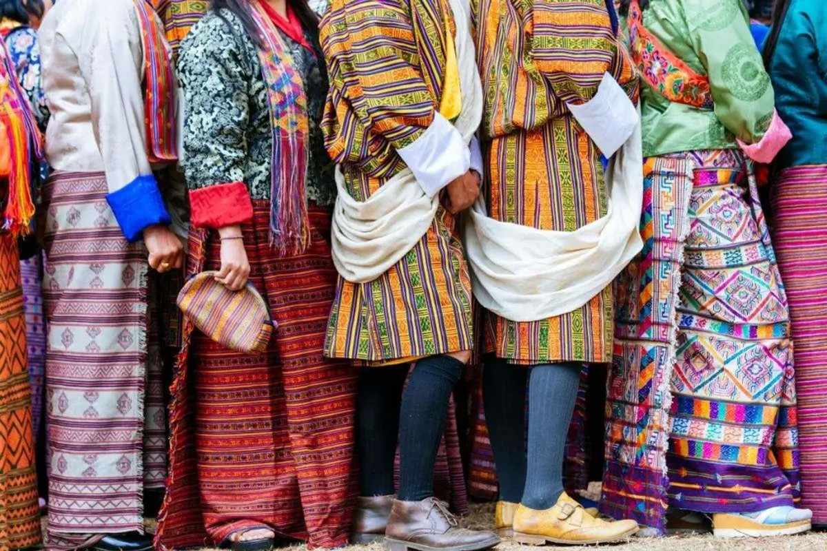 men wearing the gho and women donning the kira, adding to the festive ambiance.